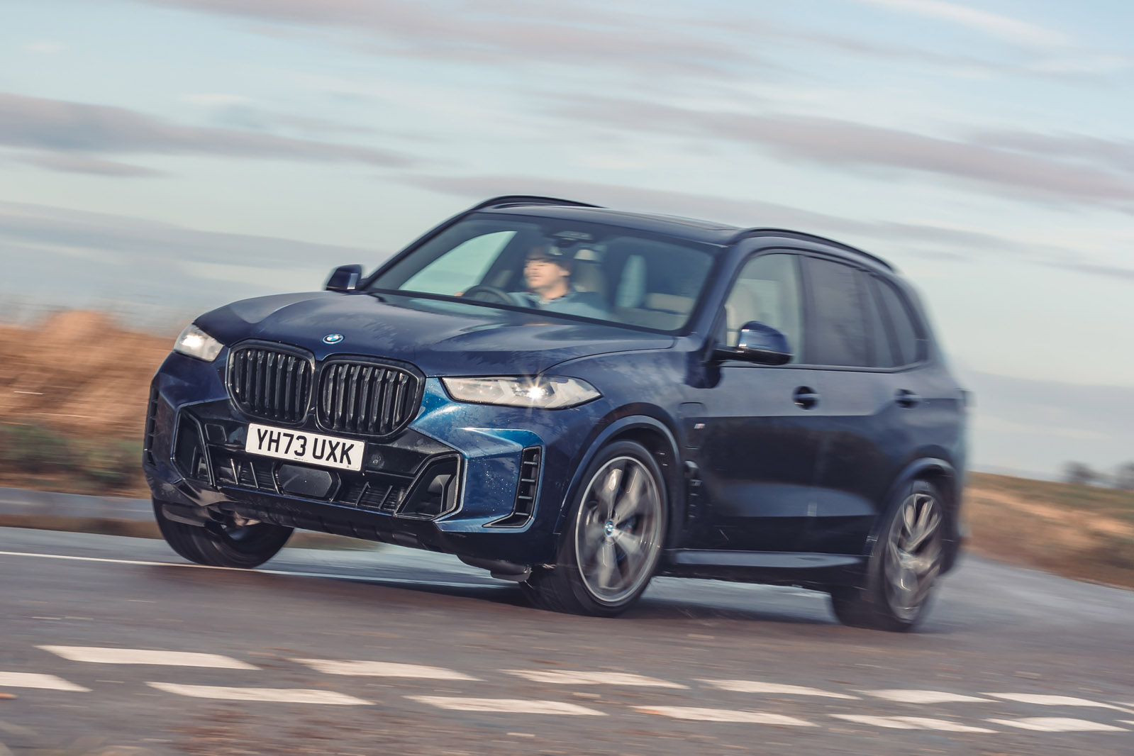 01 bmw x5 xdrive50e review 2024 lead front cornering