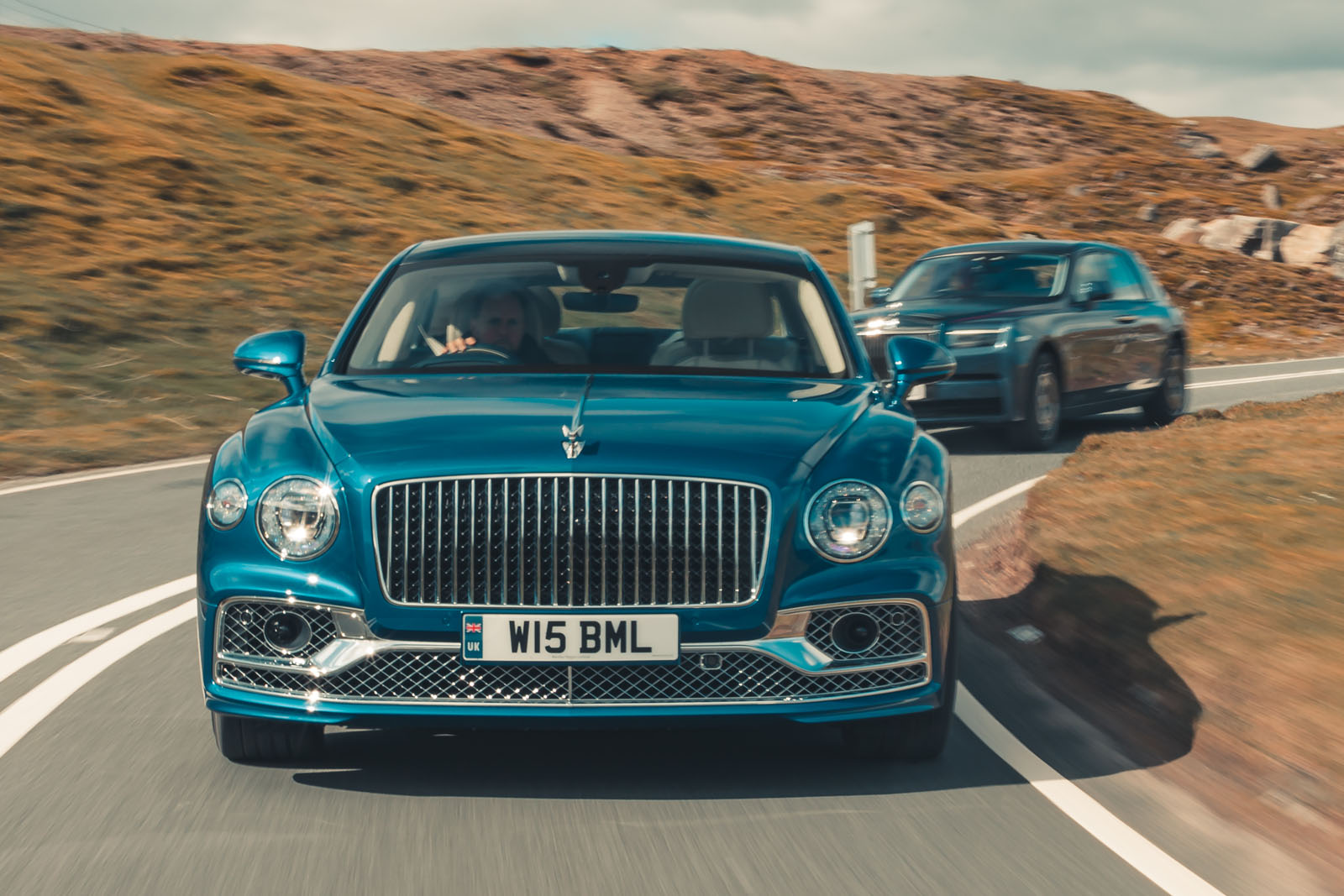 bentley flying spur rolls royce phantom front driving