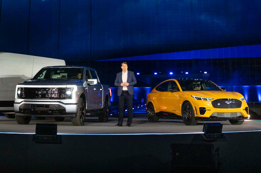 jim farley with ford f 150 lightning and ford mustang mach e 1