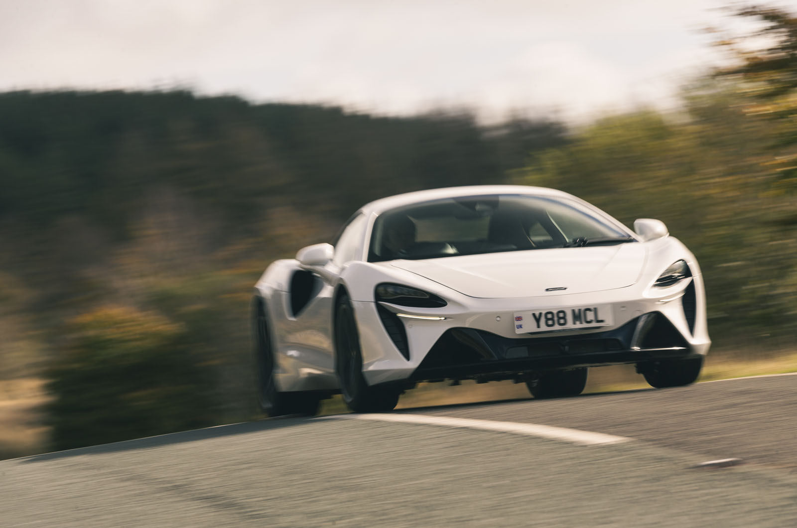 mclaren artura on road at speed
